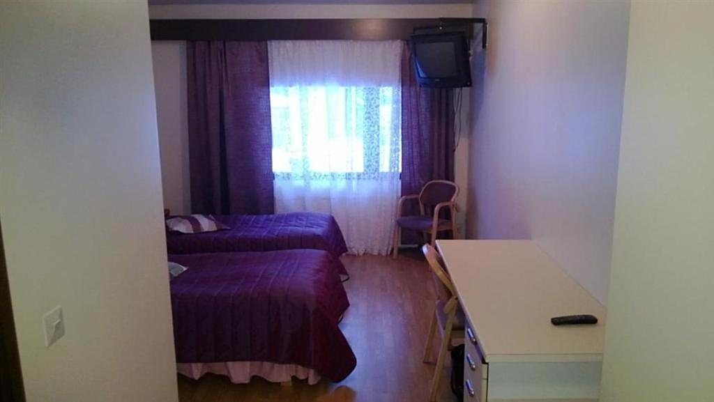 A hotel room, view from the door